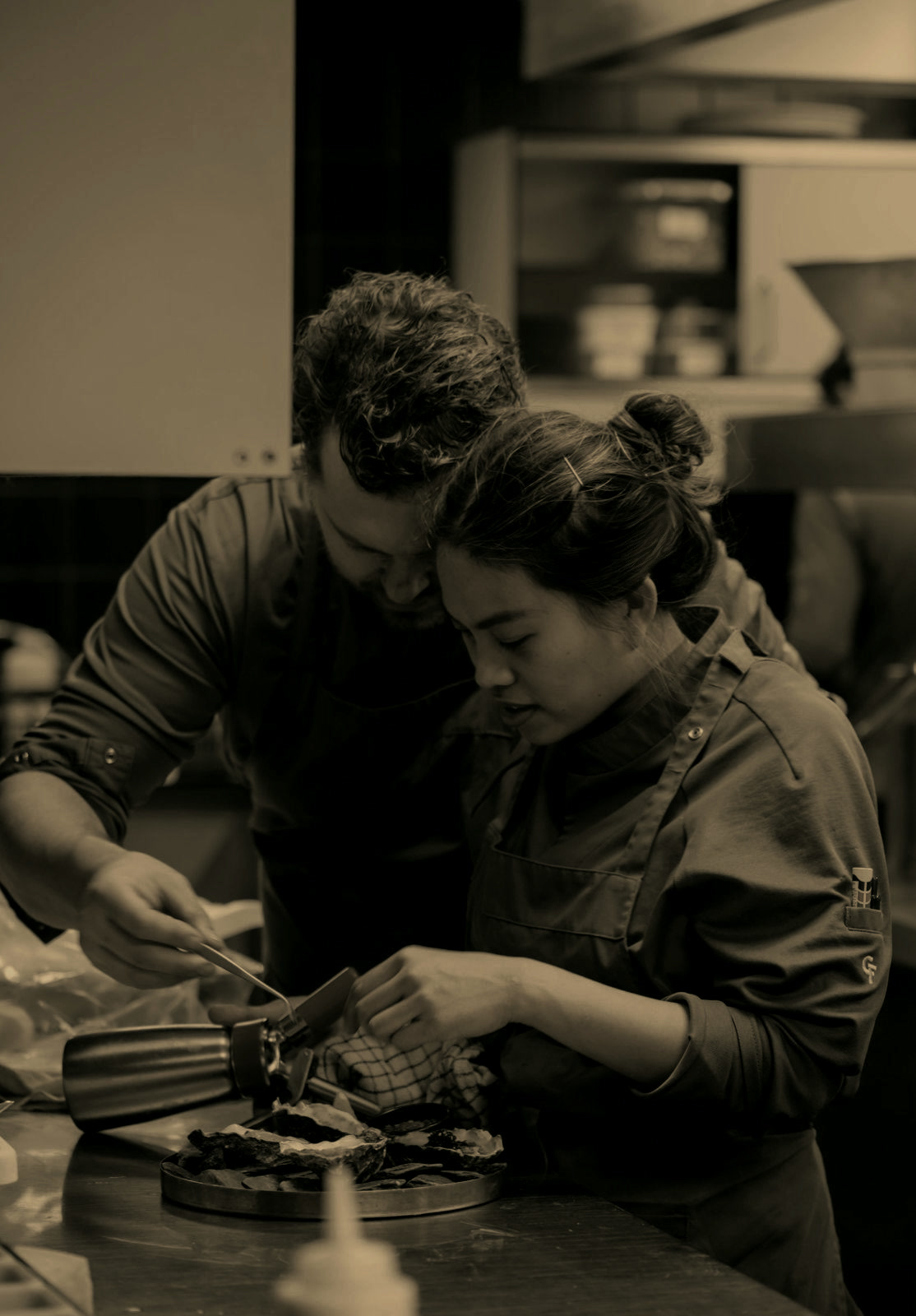 Kim and Nick working together in the kitchen